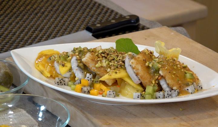 Pan-fried fish with Pistachio & Fruit slices